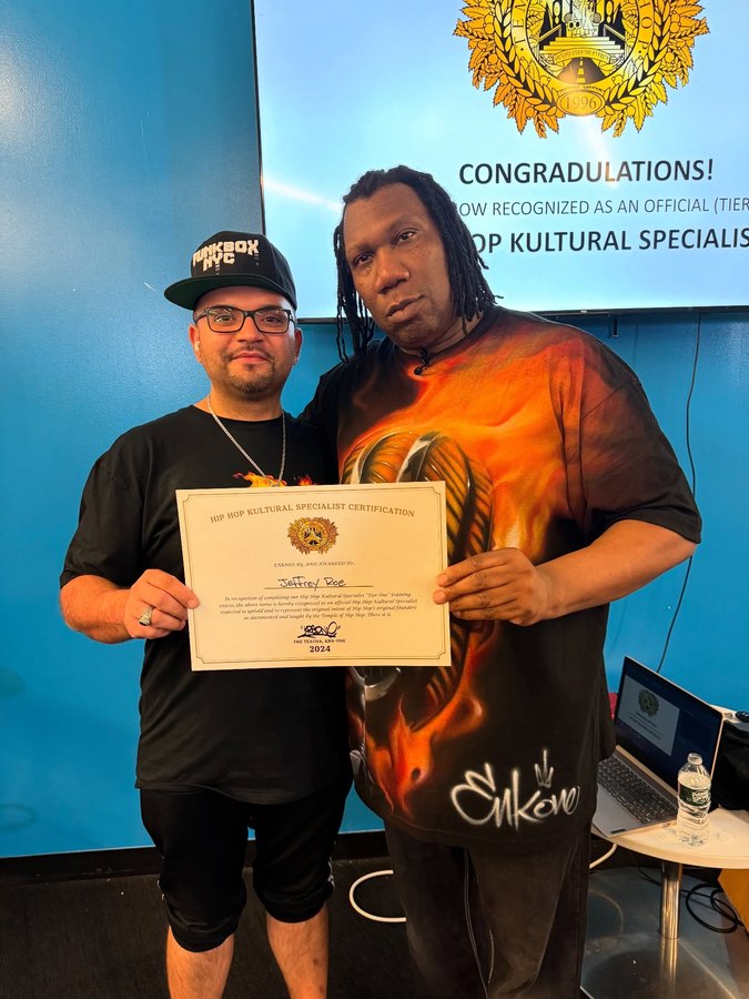 Jeff Roe with KRS-One, receiving his Hip-Hop Cultural Specialist certification